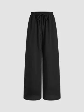 Pantalon droit noué à taille mi-haute uni